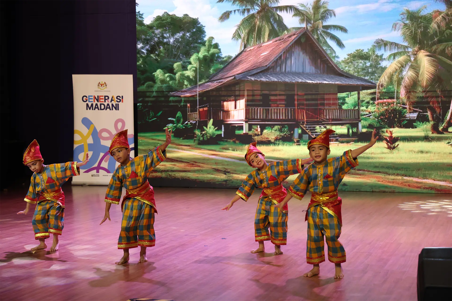 Young dancers performing a traditional cultural dance on stage