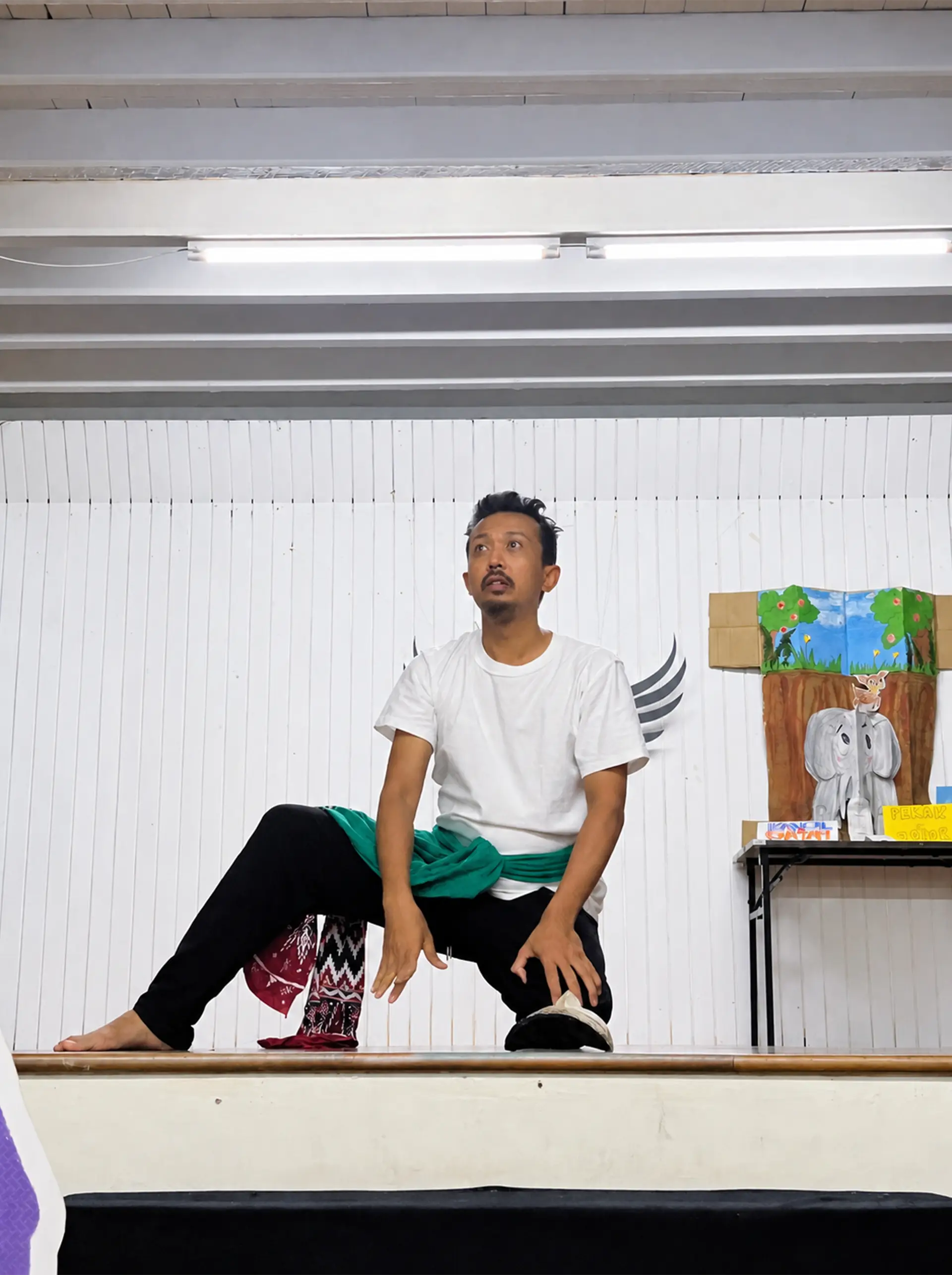 Performer demonstrating movement on stage