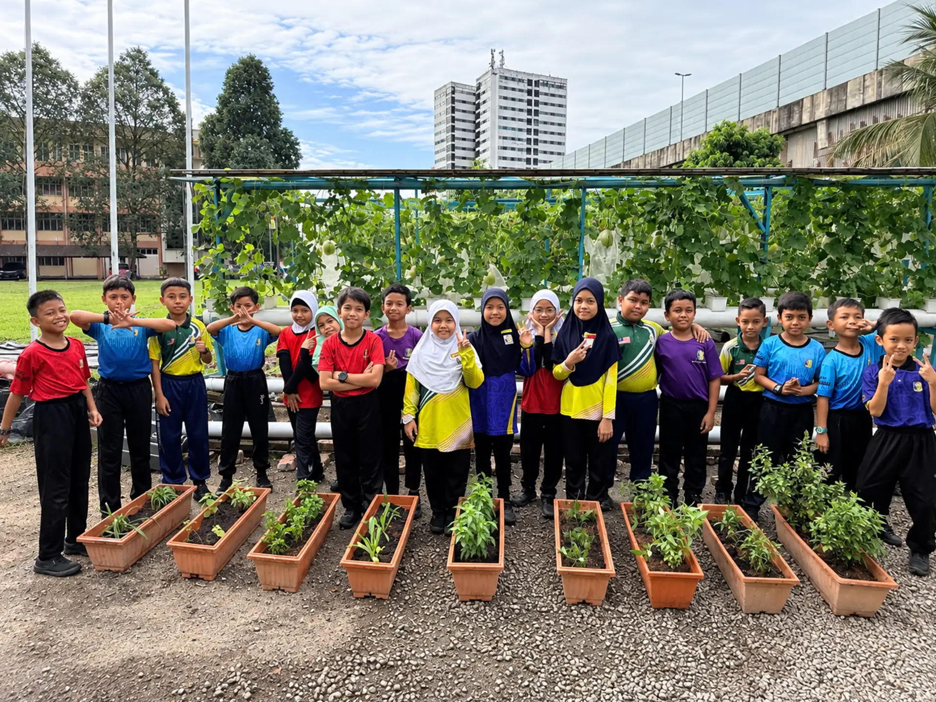 Schoolchildren standing beside vegetable planters and a growing structure