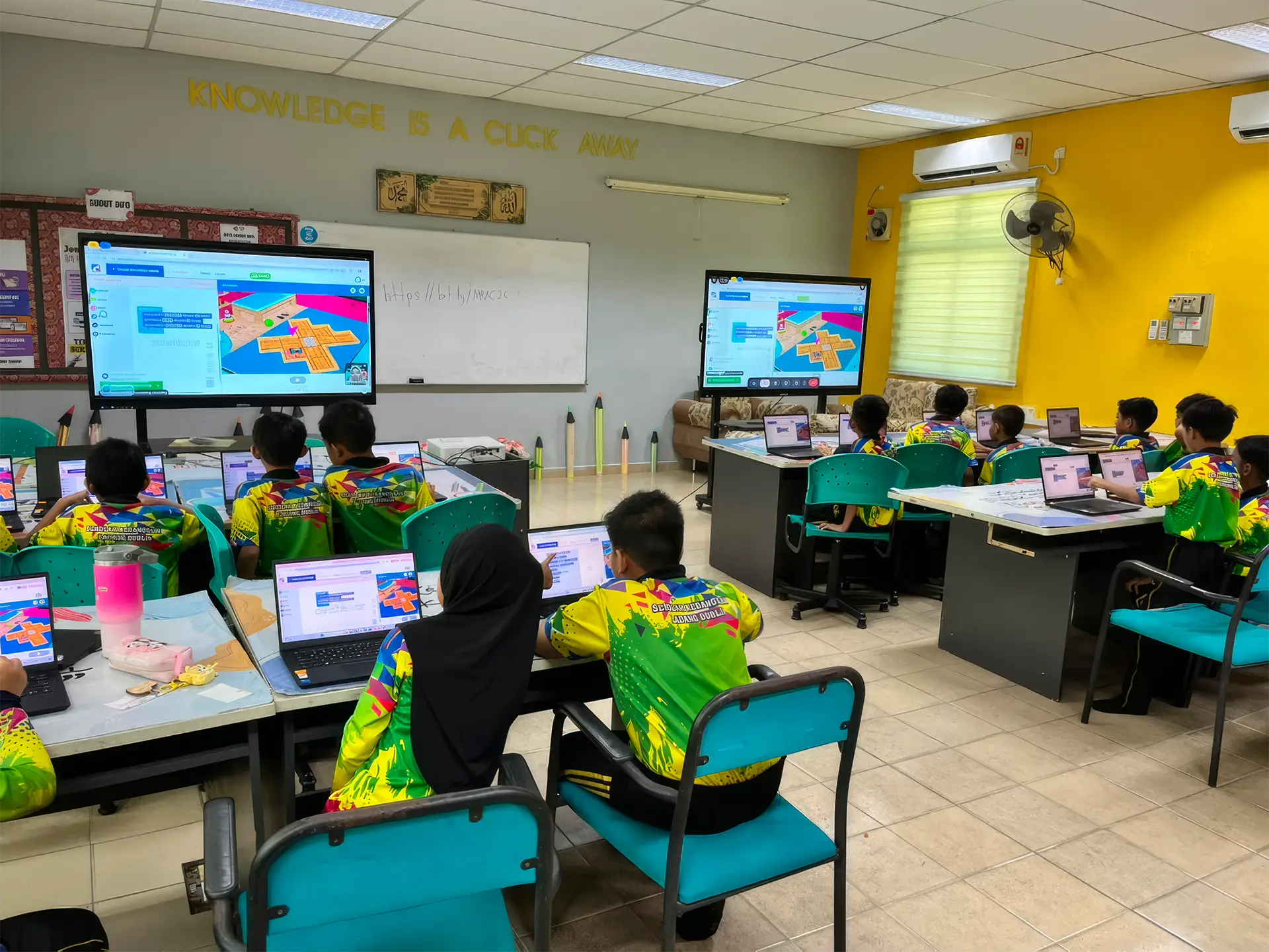 Students using laptops during a digital learning session