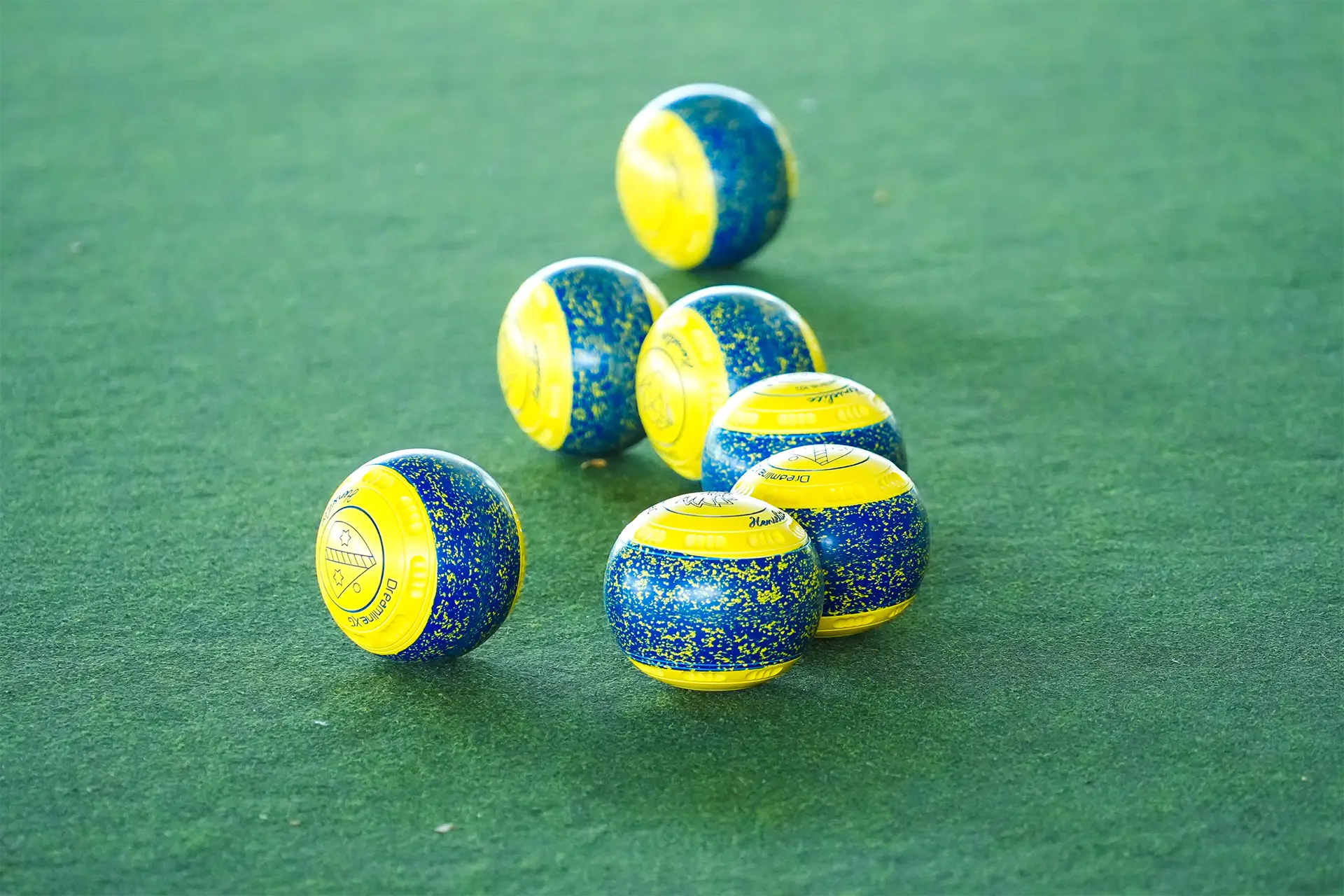 Lawn bowls arranged on the playing surface